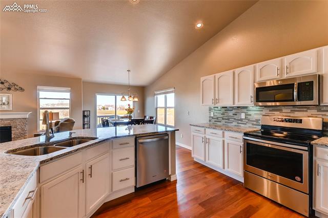11974 Rio Secco Road Peyton, CO 80831 - Photo 8 of 29 Open kitchen so you can be a part of the family gathering even while you are cooking in the kitchen.