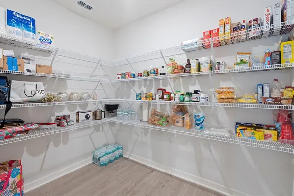 a kitchen with stainless steel appliances a sink stove and refrigerator