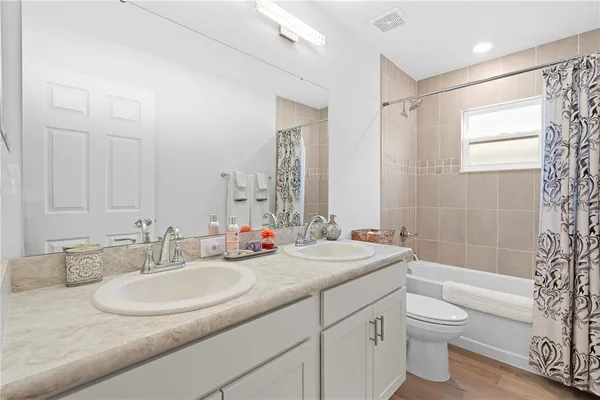 a view of storage and utility room with washer and dryer