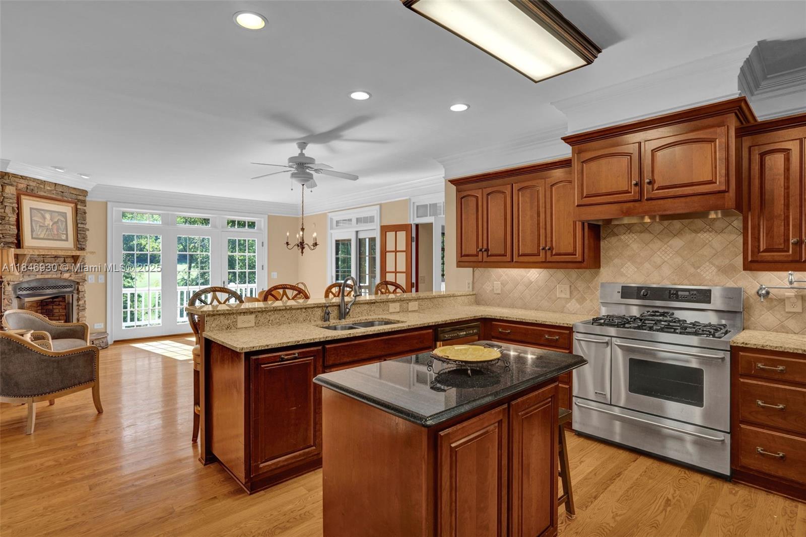 2579 Grey Rabbit Run Asheboro, NC 27205 - Photo 19 of 72 a kitchen with granite countertop a sink appliances and cabinets