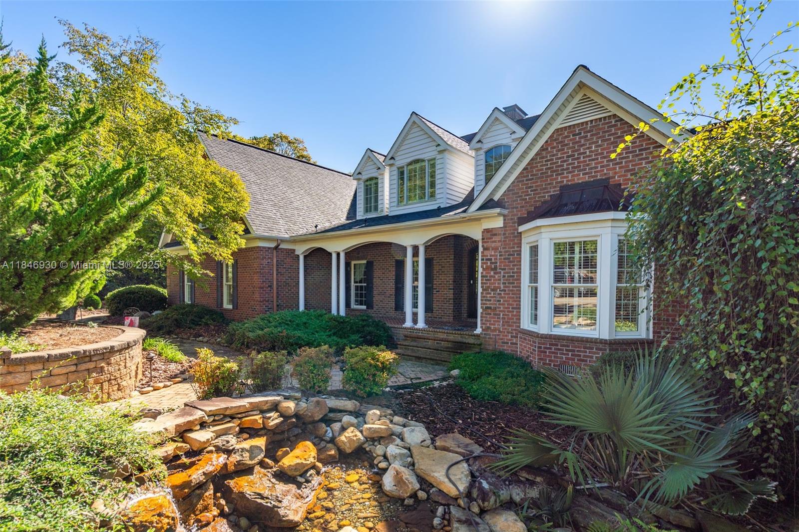 2579 Grey Rabbit Run Asheboro, NC 27205 - Photo 2 of 72 a front view of a house with garden