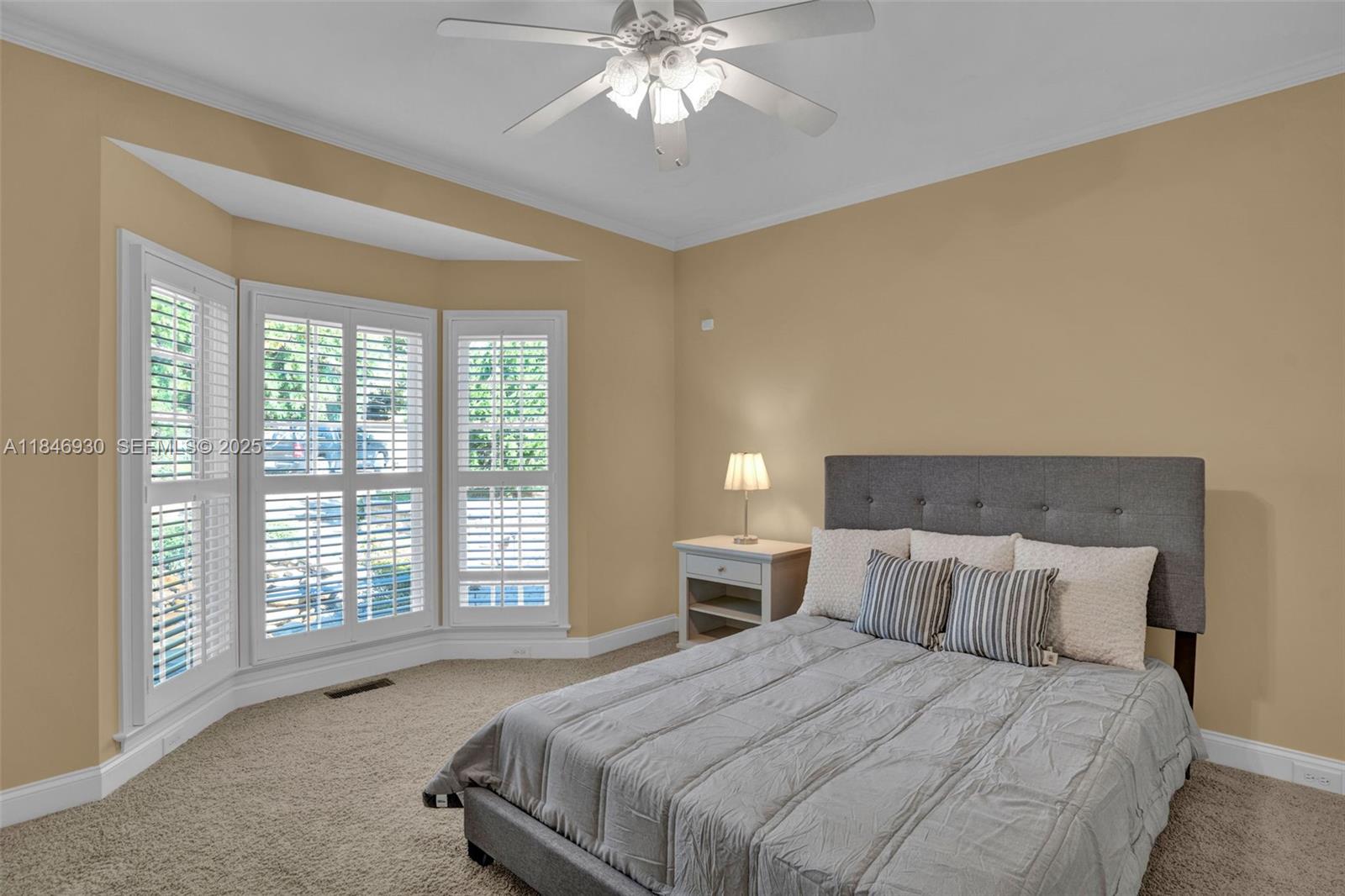 2579 Grey Rabbit Run Asheboro, NC 27205 - Photo 28 of 72 a spacious bedroom with a large bed and a chandelier