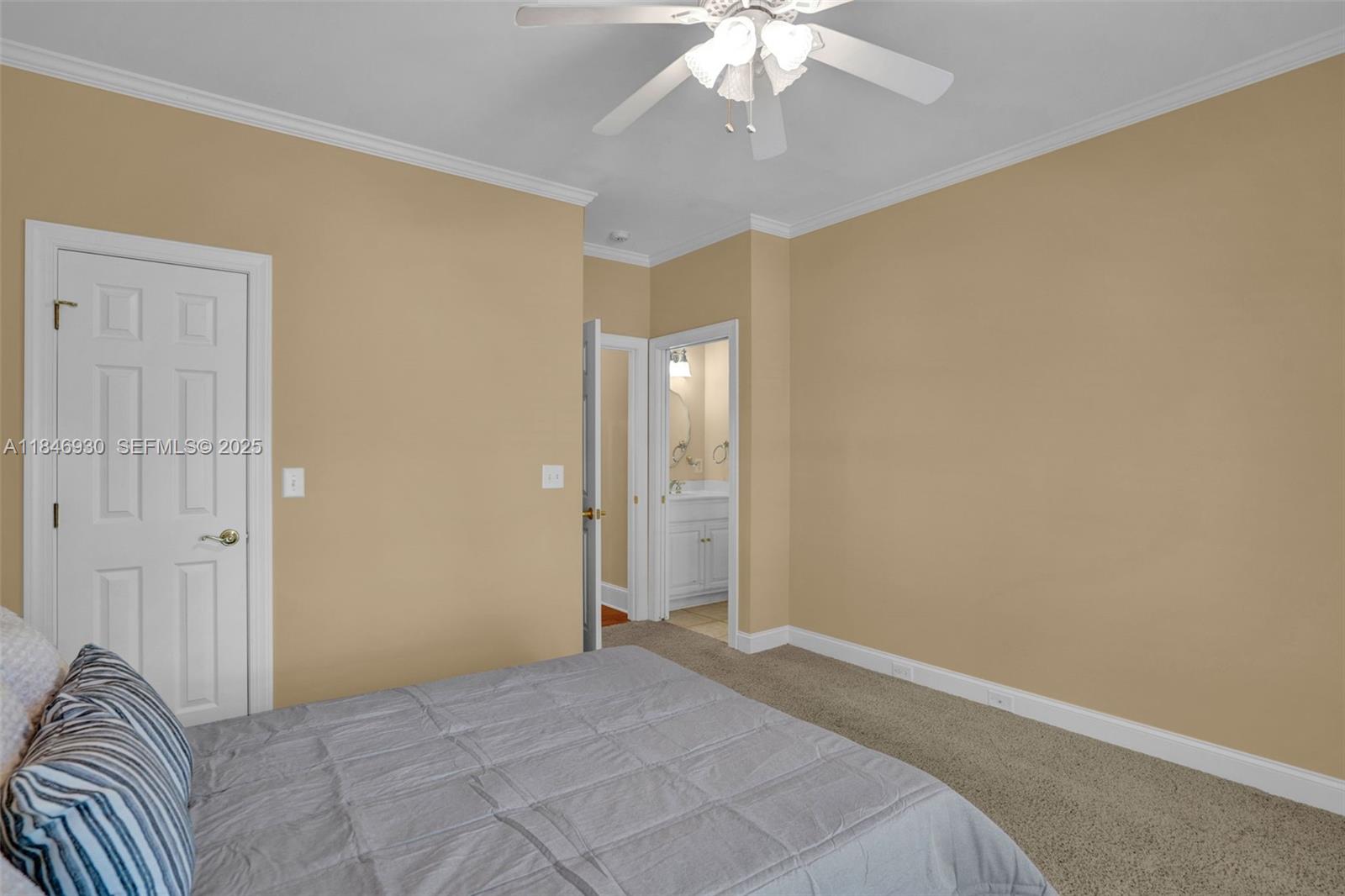 2579 Grey Rabbit Run Asheboro, NC 27205 - Photo 29 of 72 a view of a bedroom with a bed and a chandelier