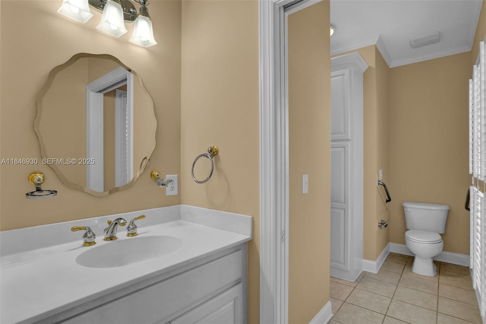 2579 Grey Rabbit Run Asheboro, NC 27205 - Photo 31 of 72 a bathroom with a toilet sink and mirror