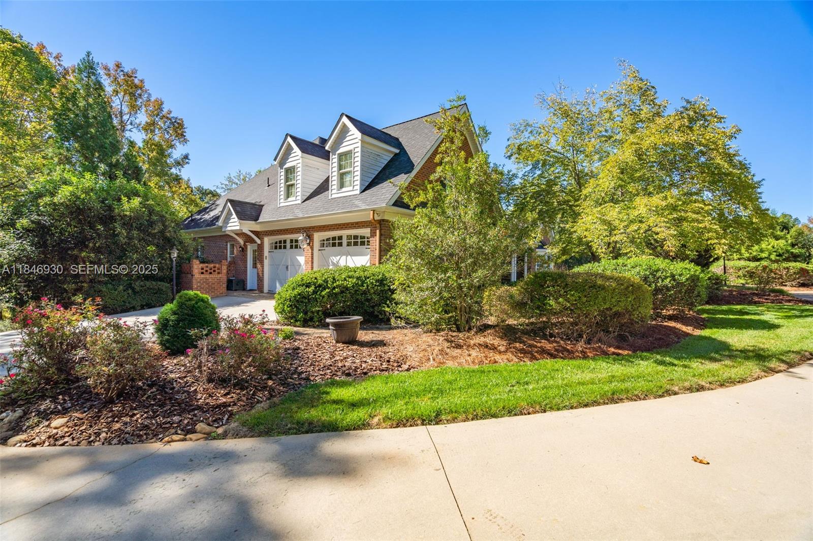 2579 Grey Rabbit Run Asheboro, NC 27205 - Photo 54 of 72 a front view of a house with a yard and potted plants