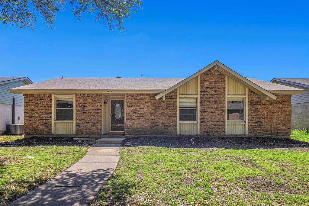 1814 Addington Drive Carrollton, TX 75007 - Photo 2 of 24 Ranch-style house featuring central air condition unit and a front lawn