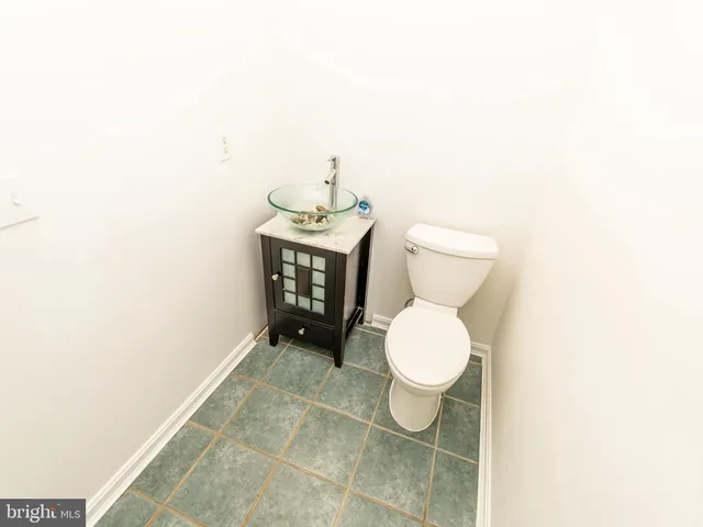 a bathroom with a toilet and a sink
