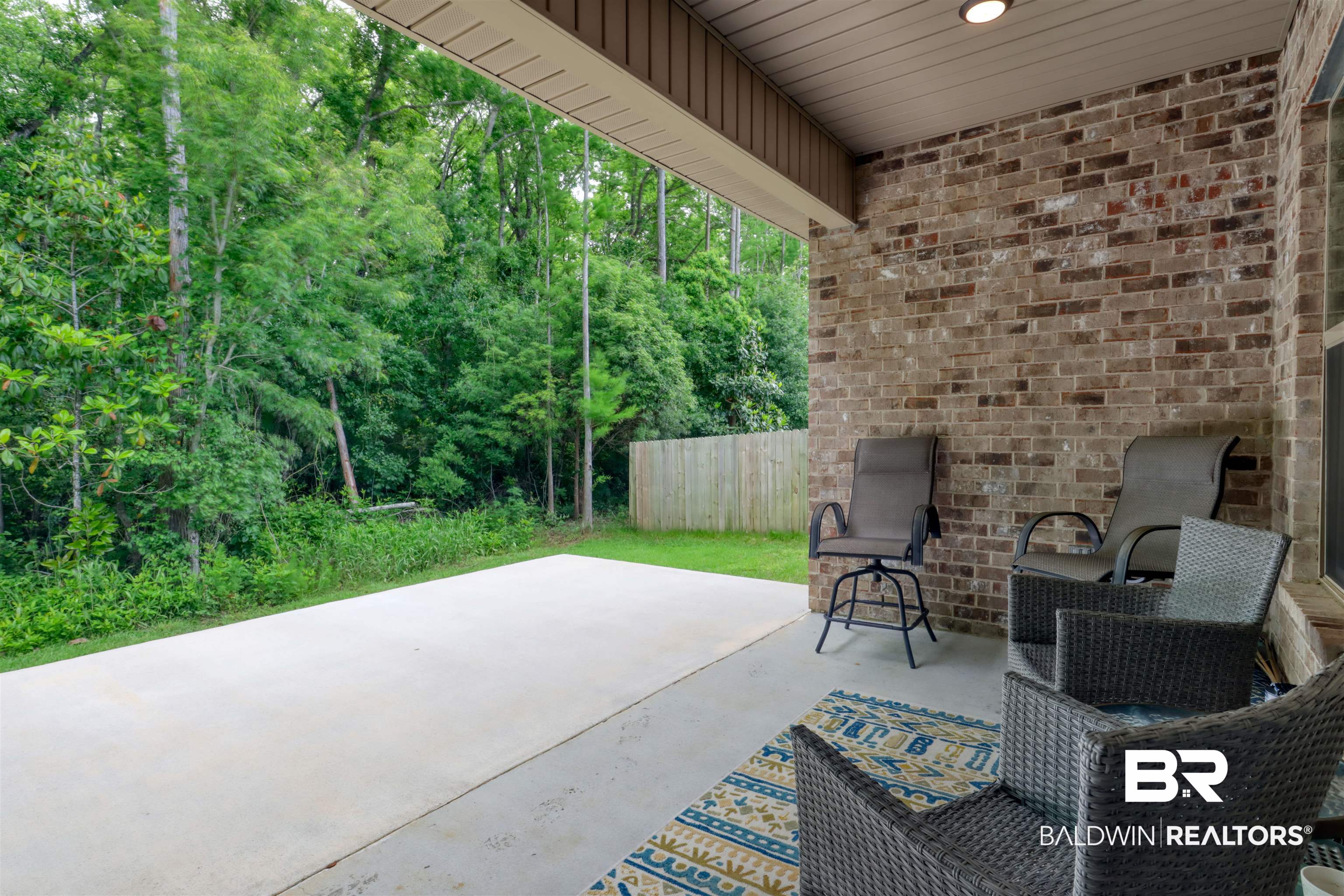 987 Gibson Court Foley, AL 36535 - Photo 29 of 34 View of patio / terrace featuring fence