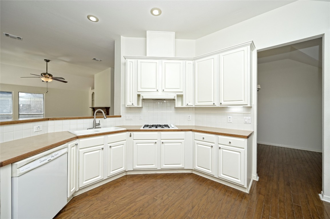 10917 Ballybunion Place Austin, TX 78747 - Photo 11 of 28 a kitchen with stainless steel appliances granite countertop a sink and cabinets