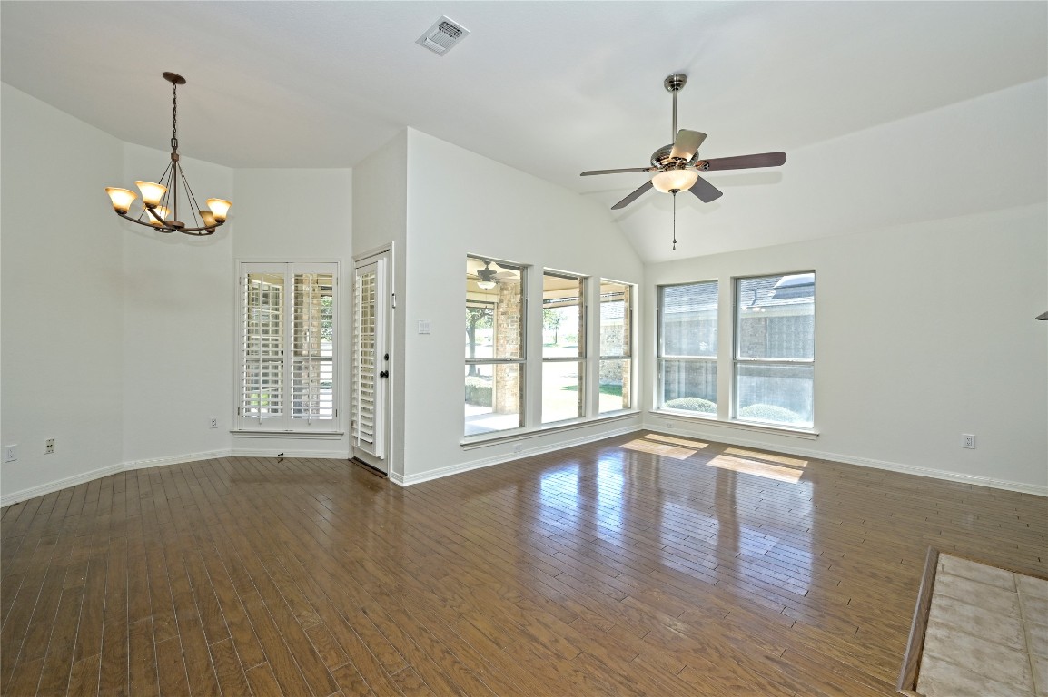 10917 Ballybunion Place Austin, TX 78747 - Photo 14 of 28 a view of an empty room with wooden floor and a window