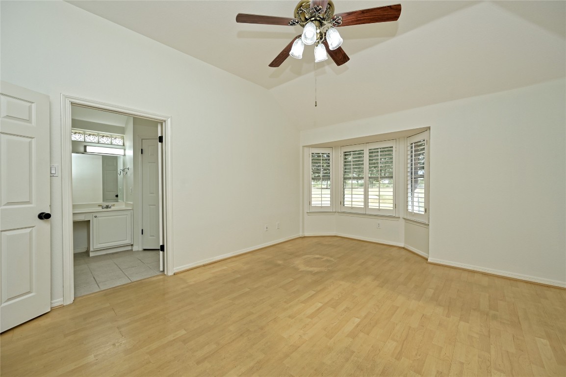 10917 Ballybunion Place Austin, TX 78747 - Photo 17 of 28 a view of an empty room with a window