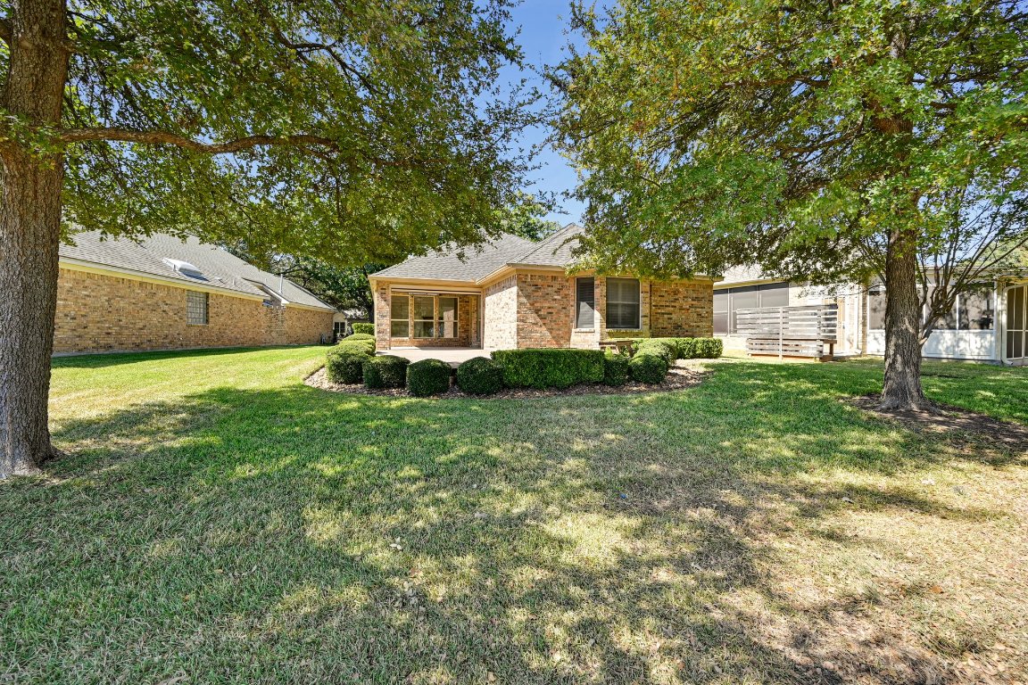 10917 Ballybunion Place Austin, TX 78747 - Photo 25 of 28 a house view with a garden space