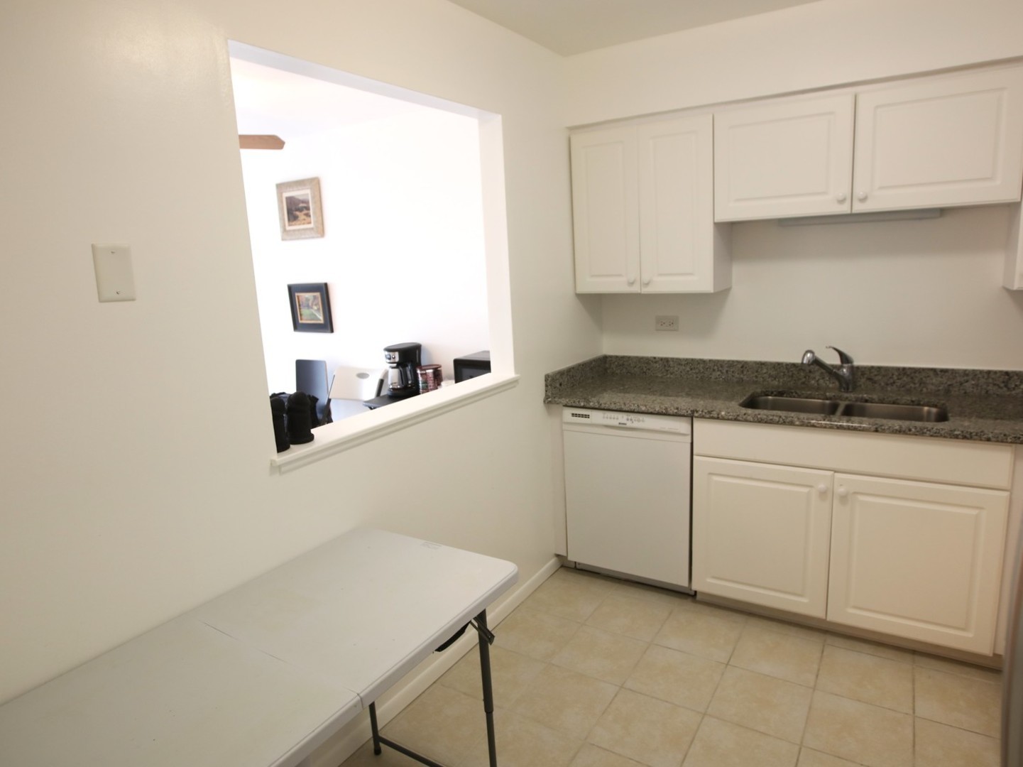 1400 North Elmhurst Road, Unit 417 Mount Prospect, IL 60056 - Photo 11 of 15 a kitchen with a sink and cabinets