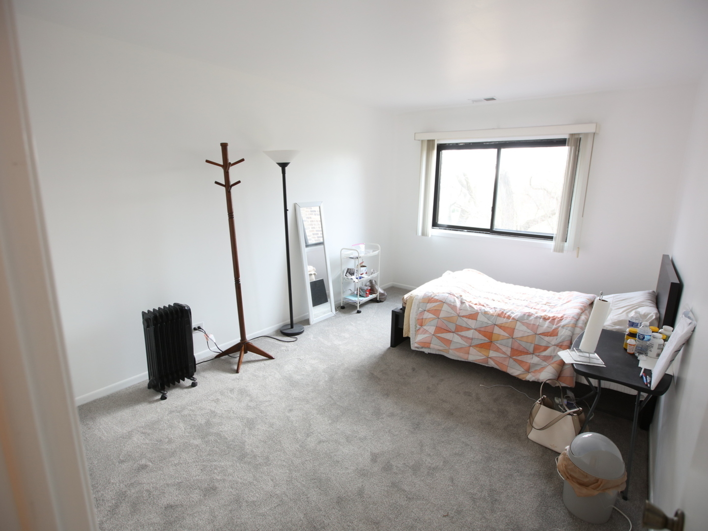1400 North Elmhurst Road, Unit 417 Mount Prospect, IL 60056 - Photo 13 of 15 a bedroom with a bed and a window