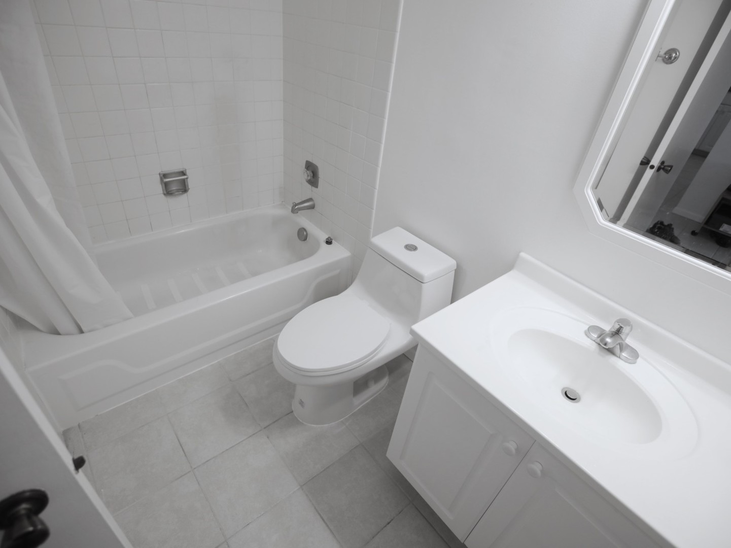 1400 North Elmhurst Road, Unit 417 Mount Prospect, IL 60056 - Photo 14 of 15 a bathroom with a toilet sink and bathtub
