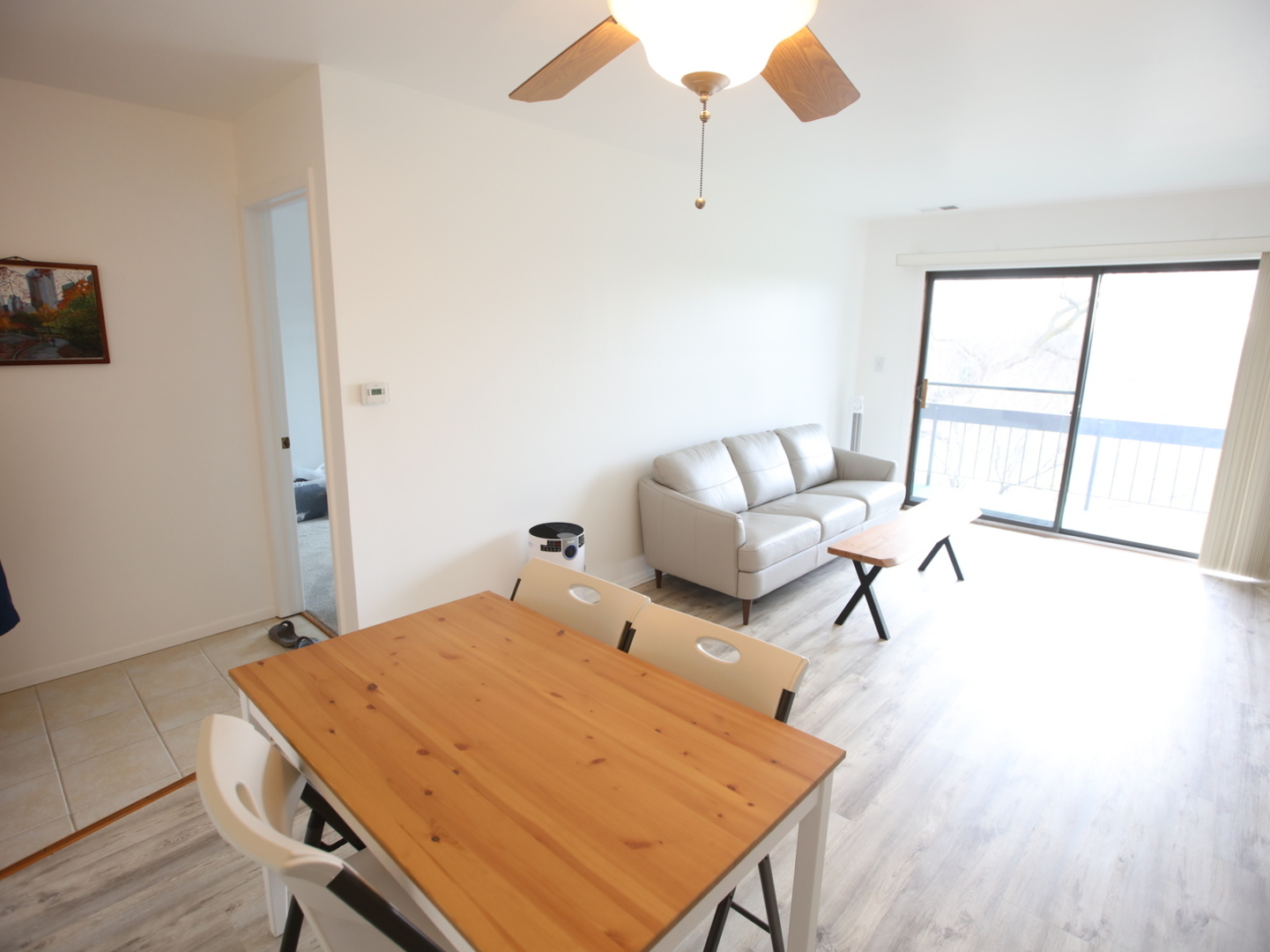 1400 North Elmhurst Road, Unit 417 Mount Prospect, IL 60056 - Photo 2 of 15 a living room with furniture and a wooden floor