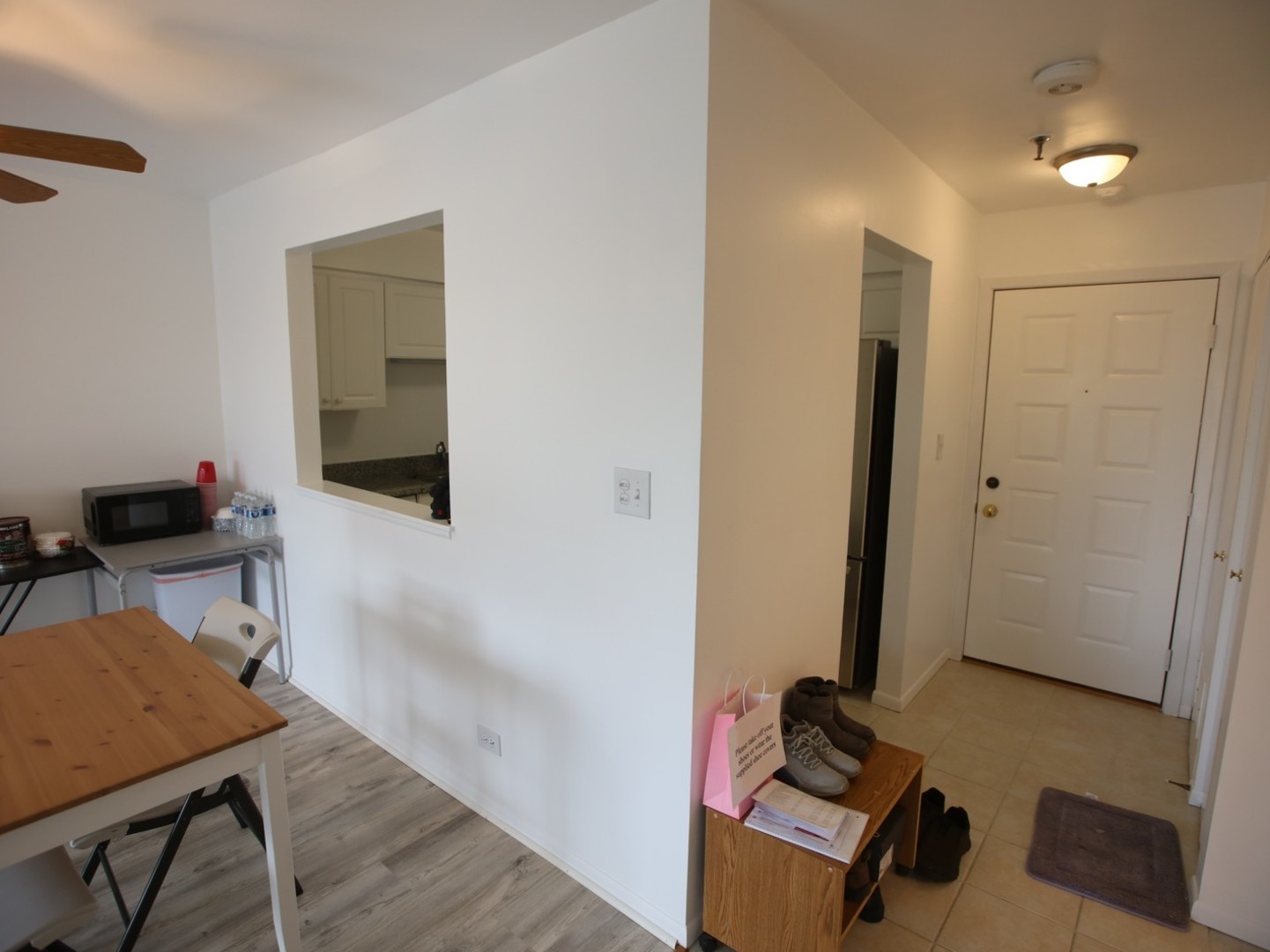 1400 North Elmhurst Road, Unit 417 Mount Prospect, IL 60056 - Photo 4 of 15 a view of a workspace with furniture and wooden floor