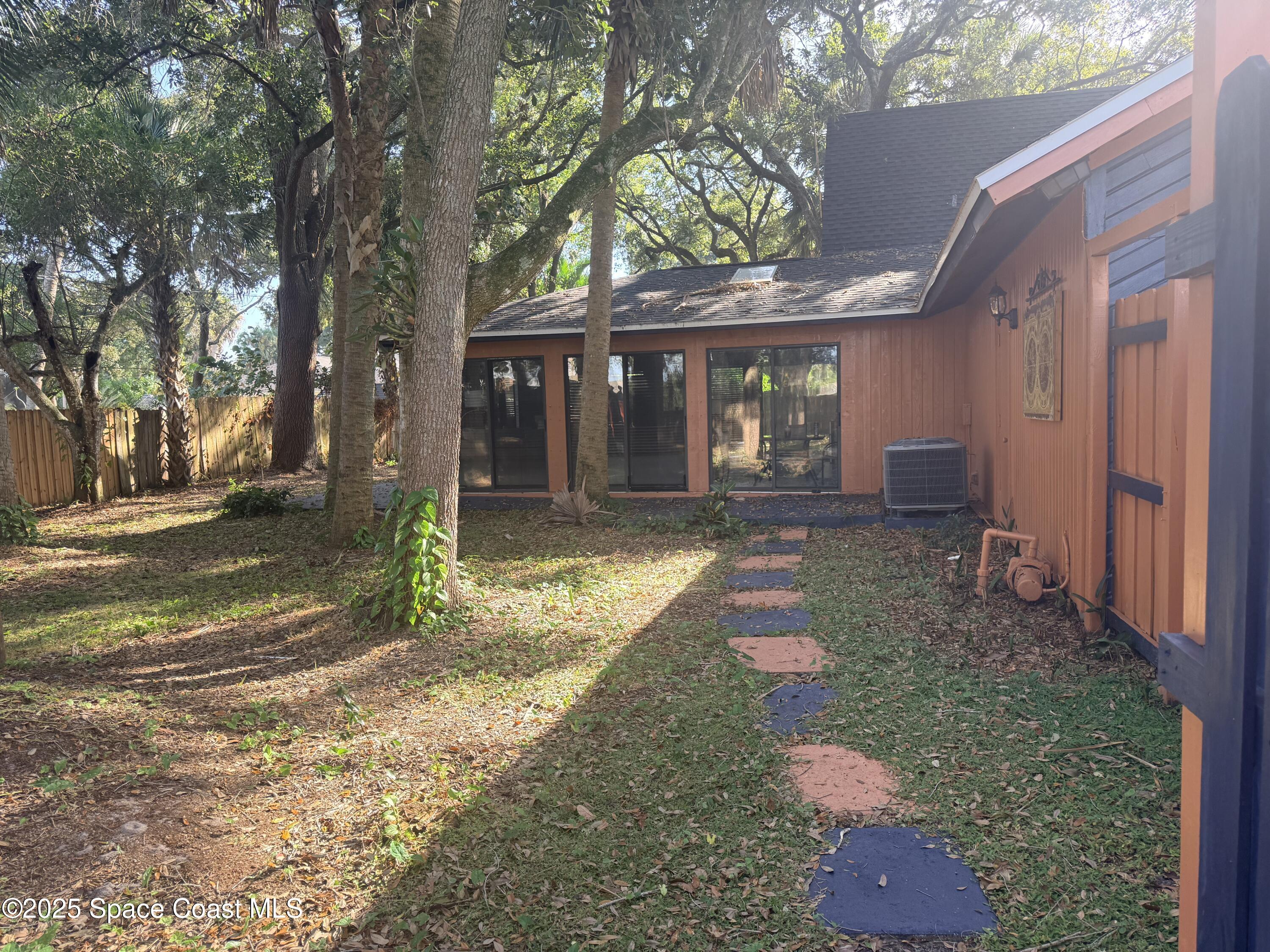 951 Pembroke Avenue Northeast Palm Bay, FL 32907 - Photo 6 of 10 a front view of a house with a yard