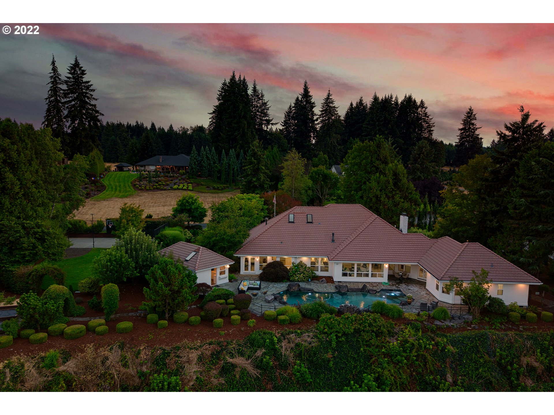 5504 Northeast 265th Street Ridgefield, WA 98642 - Photo 3 of 32 a view of a house with a garden and a lake view