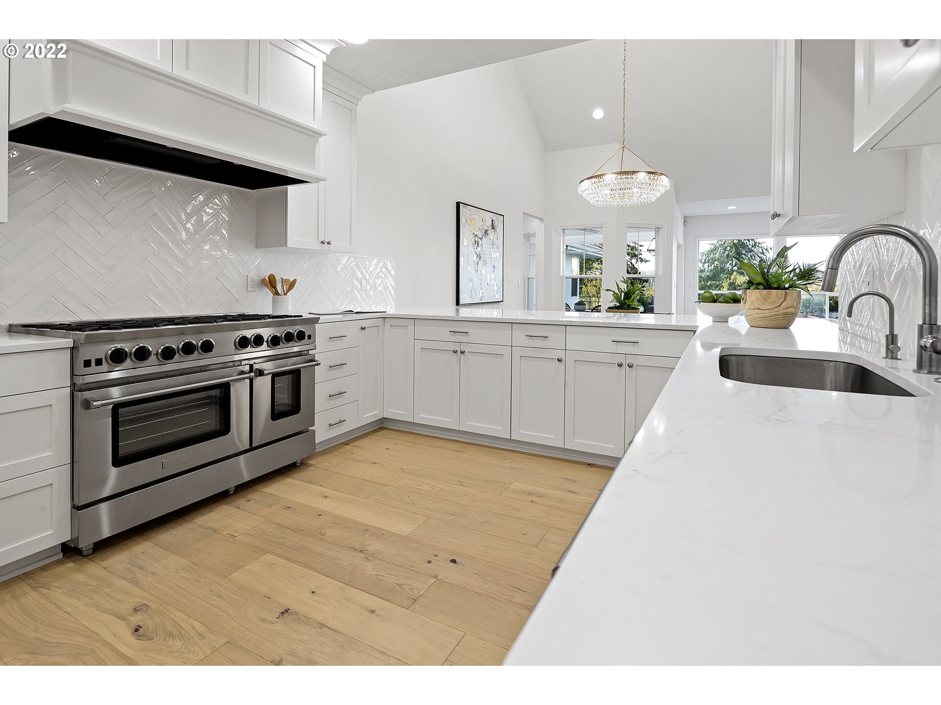 5504 Northeast 265th Street Ridgefield, WA 98642 - Photo 5 of 32 a kitchen with a stove a sink and a refrigerator