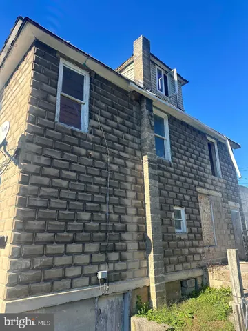 a brick house with a small yard
