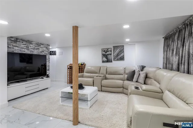 a living room with furniture and a table