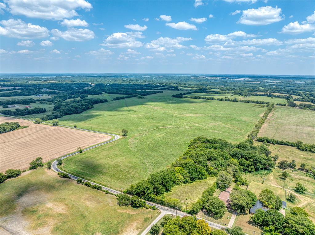 216-acres JP Cave Road Sherman, TX 75090 - Photo 9 of 10 a view of a lake with a big yard