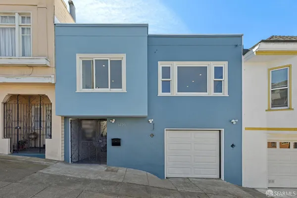 a front view of a house with a garage