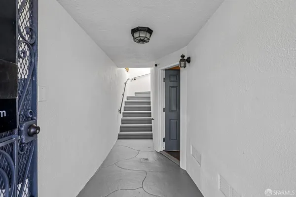 a view of staircase with a rug