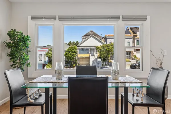 a view of a dining room with furniture window and outside view