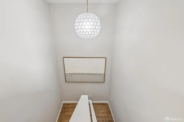 a bathroom with a sink mirror and vanity