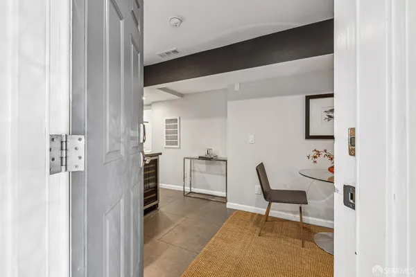 a kitchen with stainless steel appliances cabinets and a window