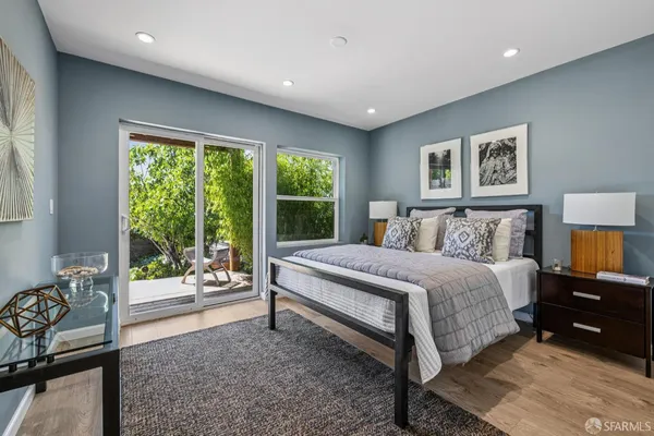 a bedroom with a large bed and a tv on table