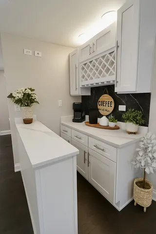 a kitchen with sink and cabinets