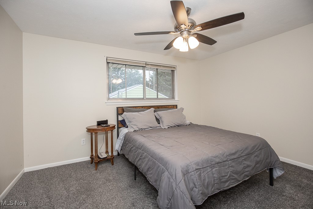4357 Valleyside Road Cleveland, OH 44135 - Photo 13 of 26 Bedroom featuring dark carpet and ceiling fan