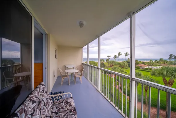 a view of a balcony with chairs