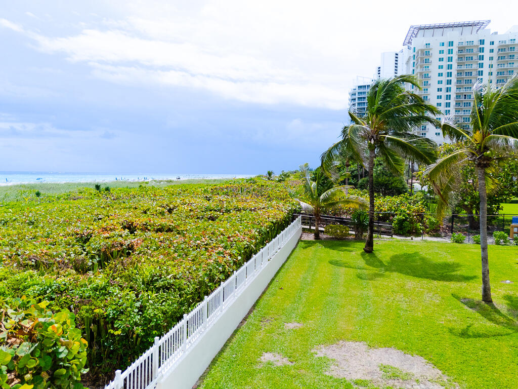 3600 North Ocean Drive, Unit 421 Singer Island, FL 33404 - Photo 27 of 31 a view of a swimming pool with a garden