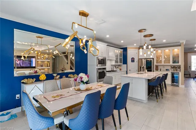 a view of a dining area with furniture and a chandelier