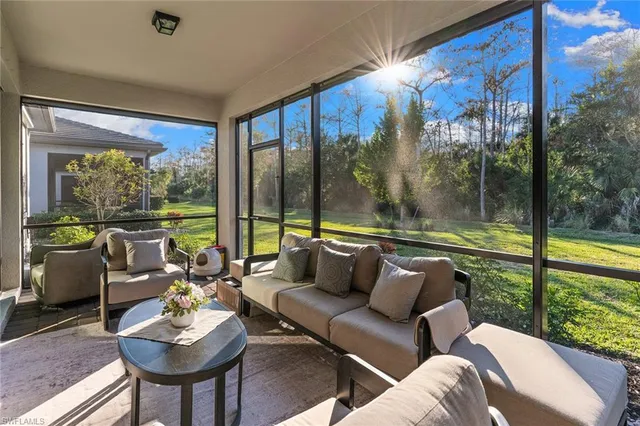a balcony with furniture and garden view