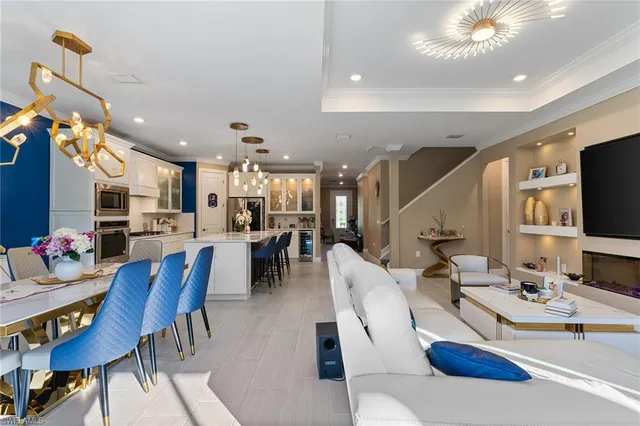 a living room with lots of furniture and a flat screen tv