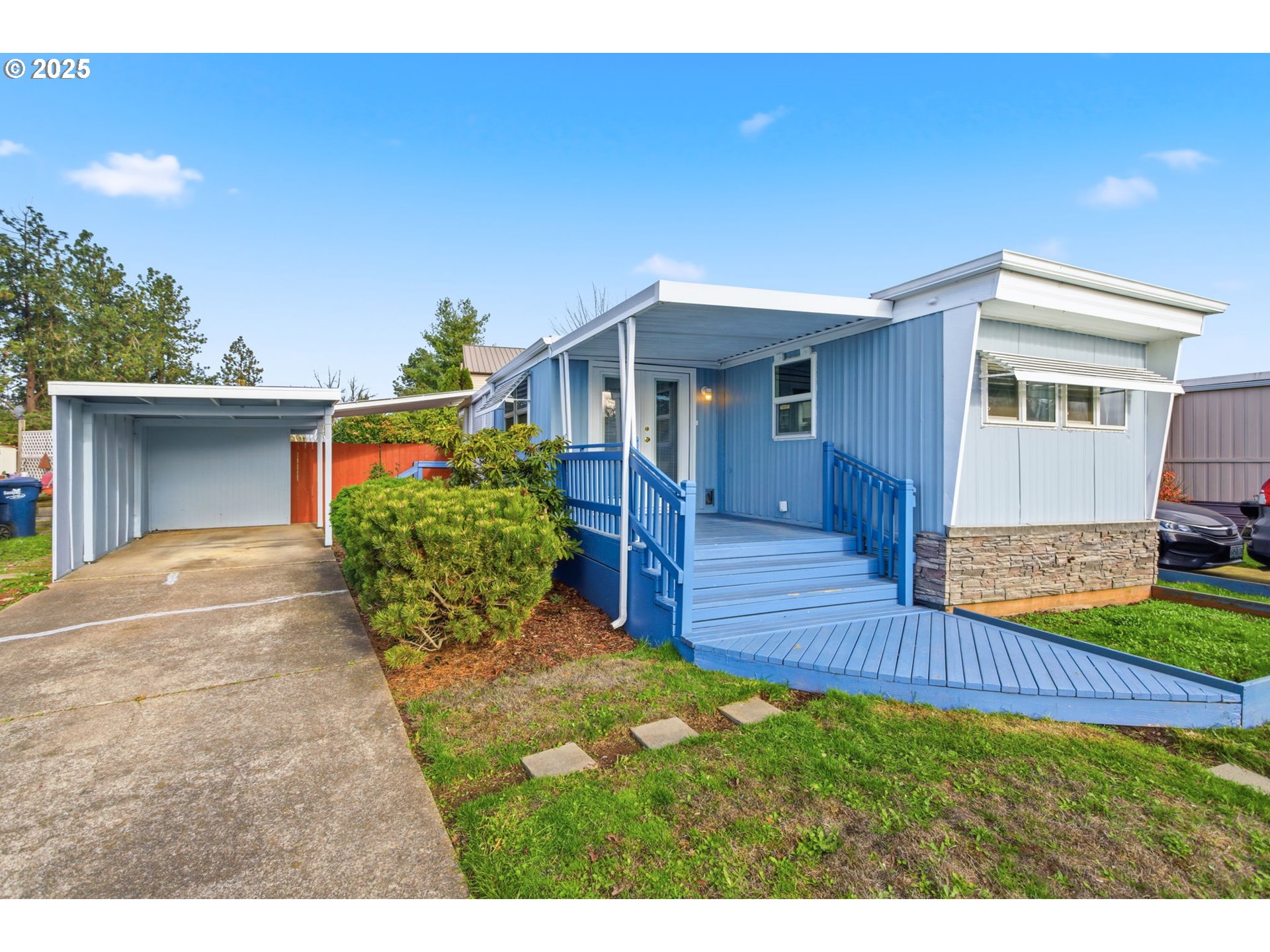 a view of a house with wooden floor and a yard