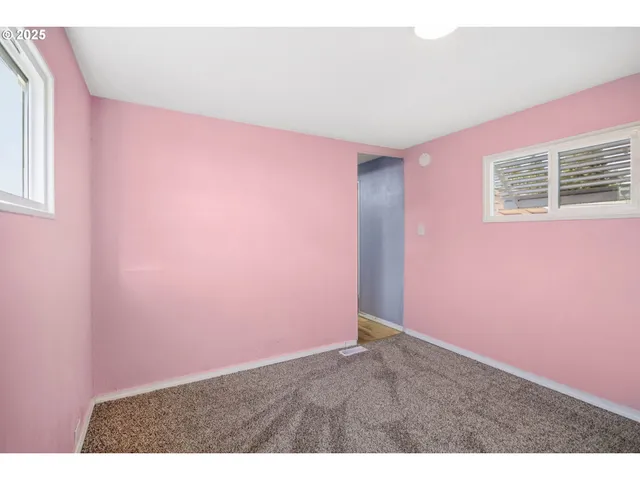 a bathroom with a granite countertop sink a mirror and vanity
