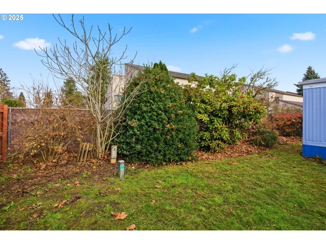 a kitchen with a sink a stove and cabinets