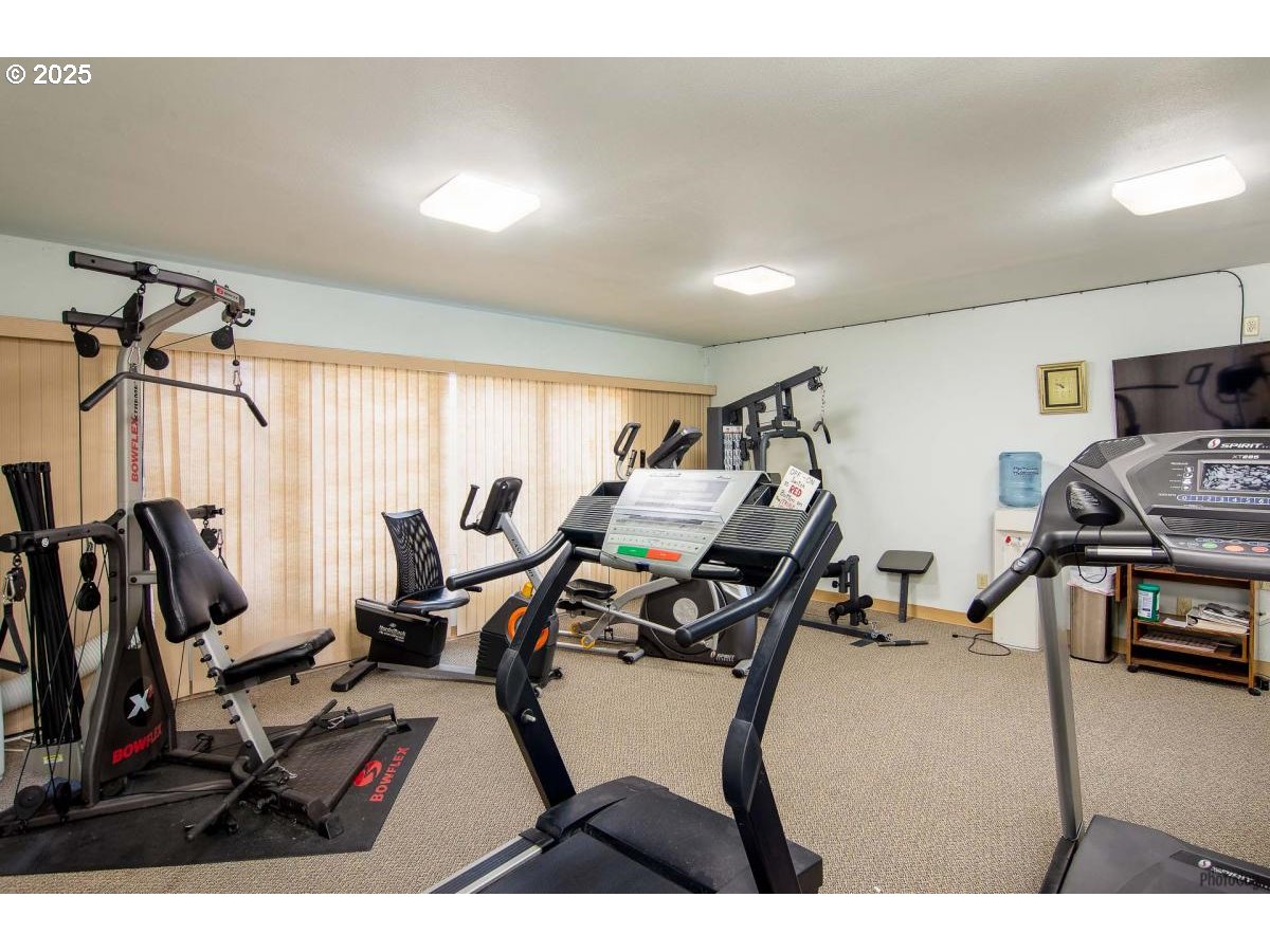 2150 Laura Street, Unit 83 Springfield, OR 97477 - Photo 34 of 40 a room with gym equipment and a window