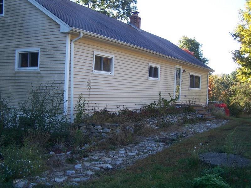148 Putnam Road Plainfield, CT 06332 - Photo 1 of 1 a view of house with backyard and trees