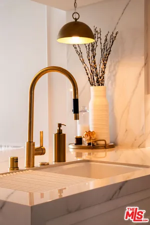 a spacious bathroom with a tub shower and sink
