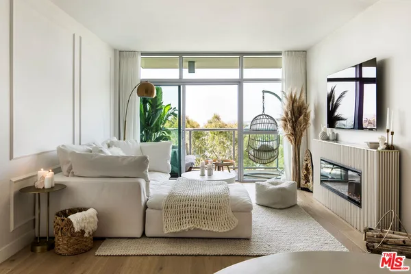 a living room with a couch and a flat screen tv