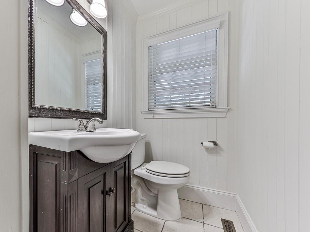 633 Butterworth Road Canton, GA 30114 - Photo 29 of 55 a bathroom with a sink toilet and a mirror
