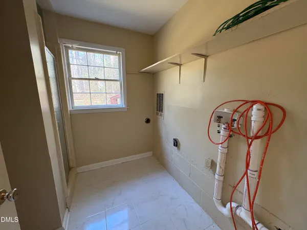 a view of a hallway with windows