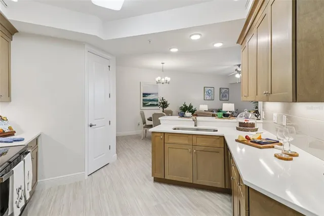 a room with furniture a flat screen tv and a window